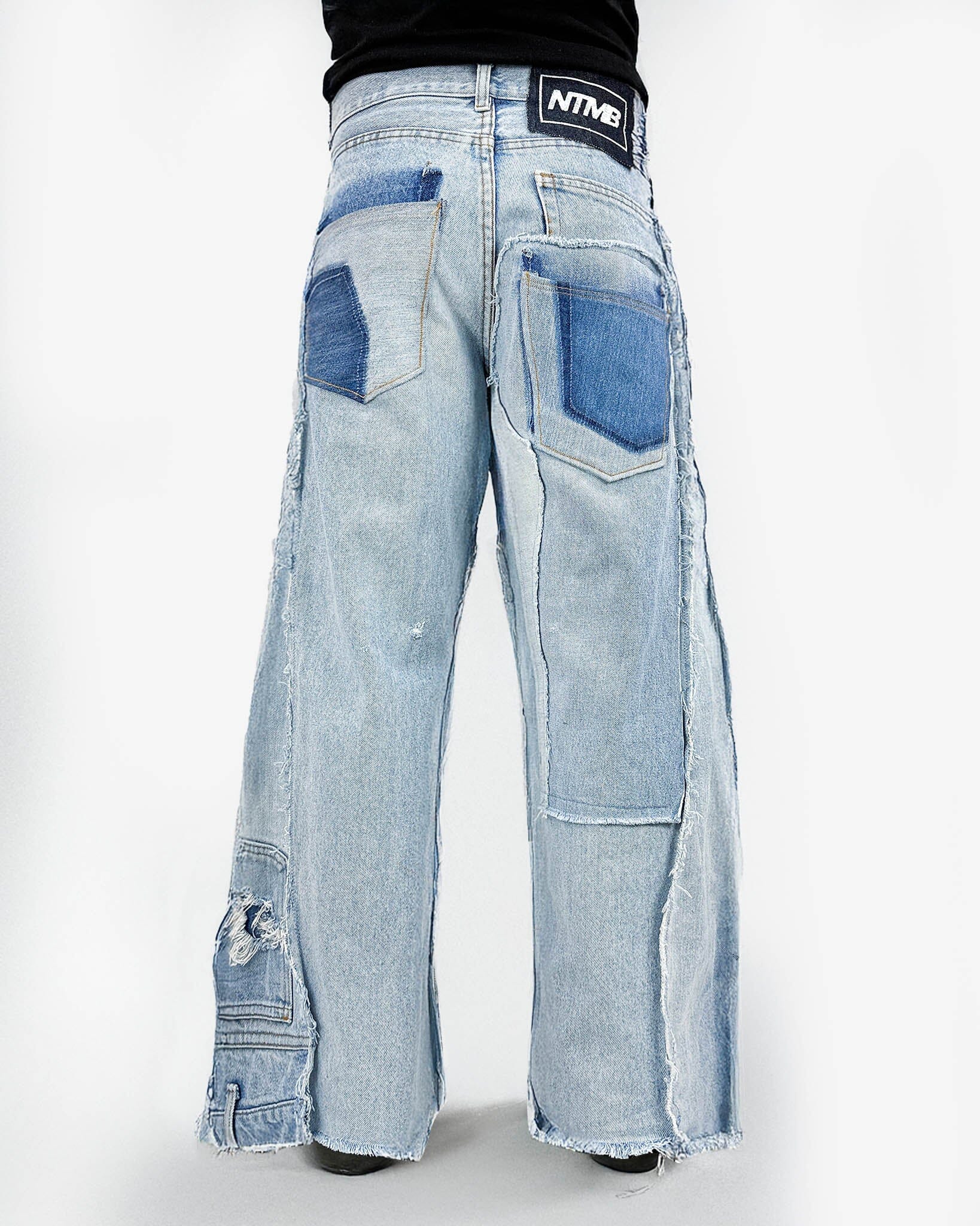 Triple Jeans Light Blue – wide leg denim made from 3 vintage jeans. Light blue stonewash, raw edges, and oversized unisex fit. Unique reconstructed streetwear design.